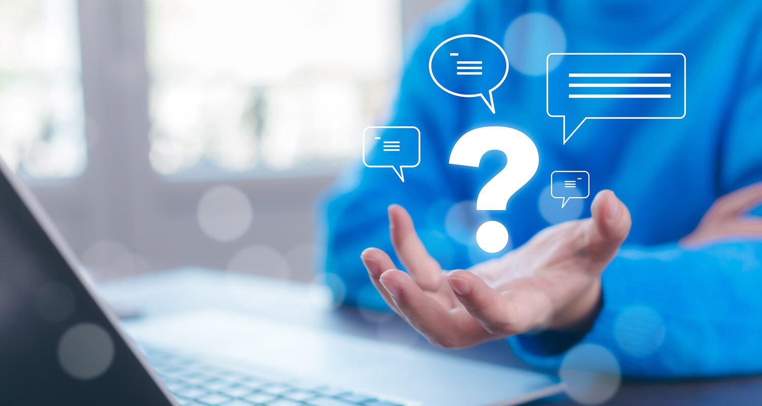 A person gesturing toward floating question mark and message icons